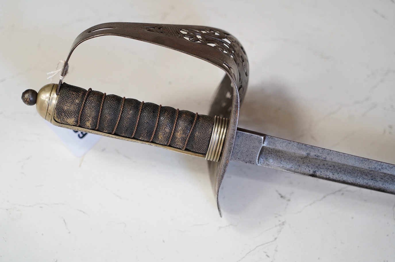 An 1897 pattern infantry officer’s sword, blade etched with crowned VR cypher, steel guard with GVR cypher, blade 83cm. Condition - fair, generally worn